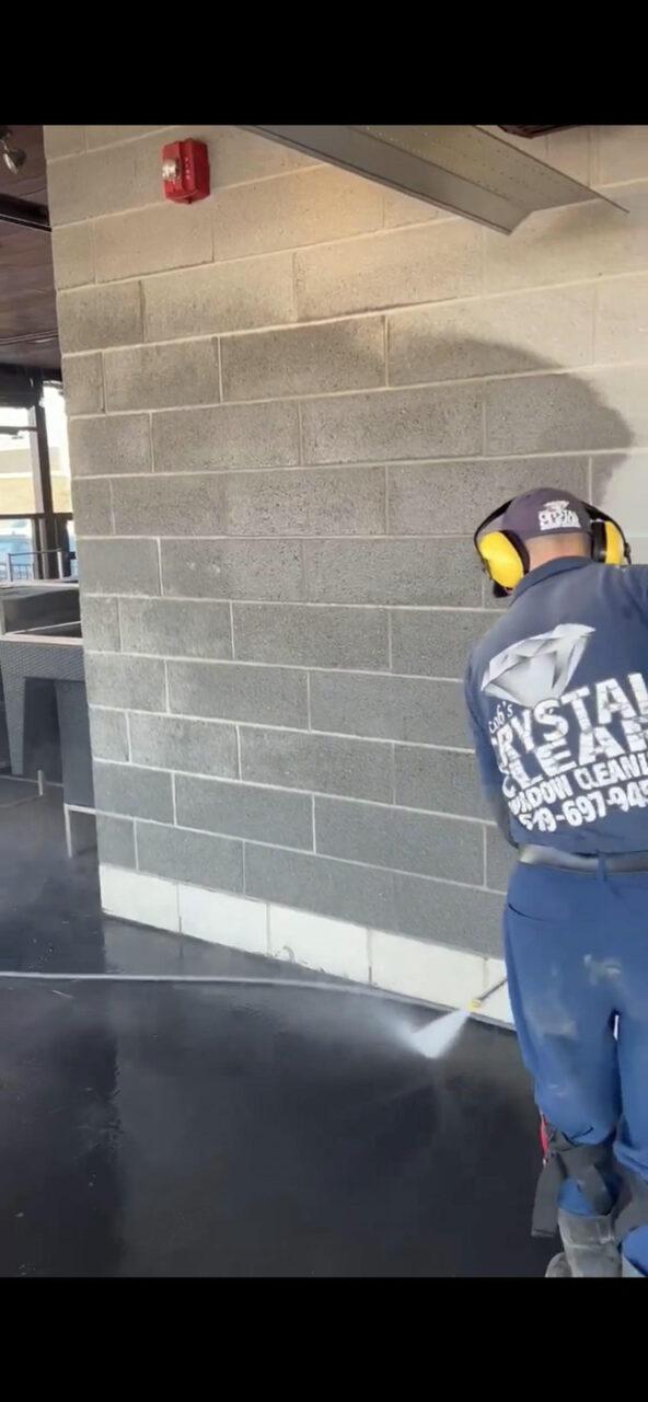 Power washing concrete floor at Local London Ontario business